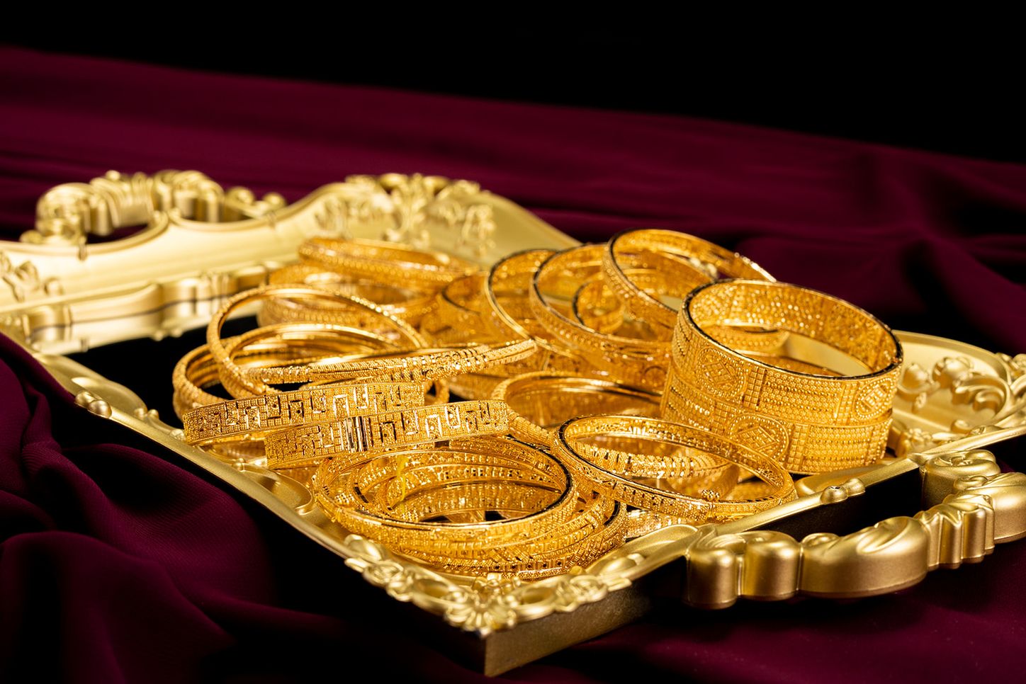 22k gold bangles on a velvet tray at Sonei Jewellers Surrey