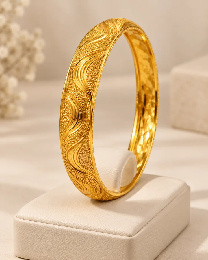 Wave engraved bangle, gold bangle at Sonei Jewellers Surrey